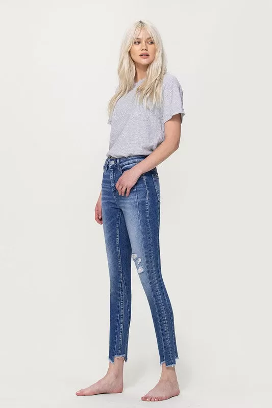 HIGH RISE ANKLE SKINNY WITH UNEVEN HEM DETAIL